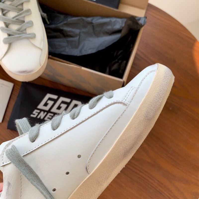 golden goose S*per-star sneakers with sliver glitter and red heel tab