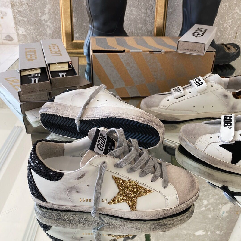 golden goose men’s S*per-star sneakers with golden glitter and black heel tab
