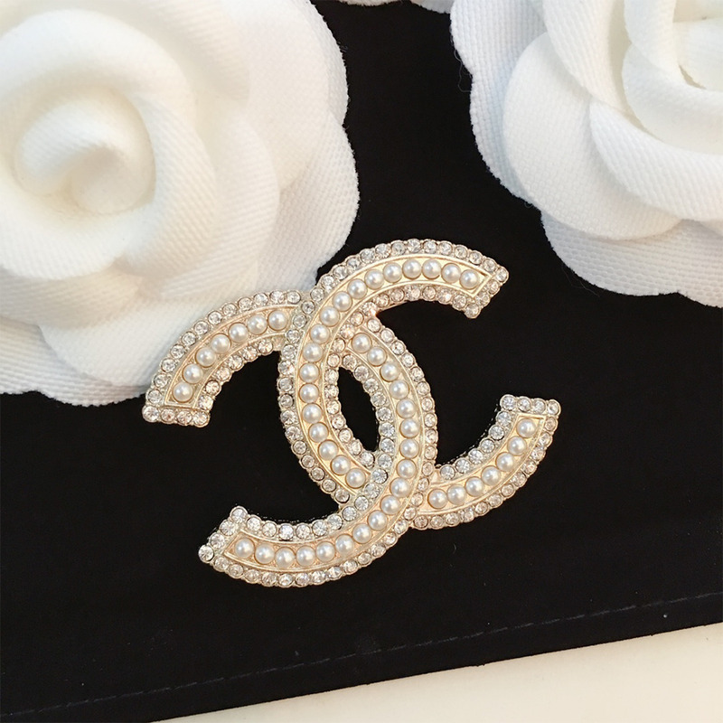 Ch*el brooch