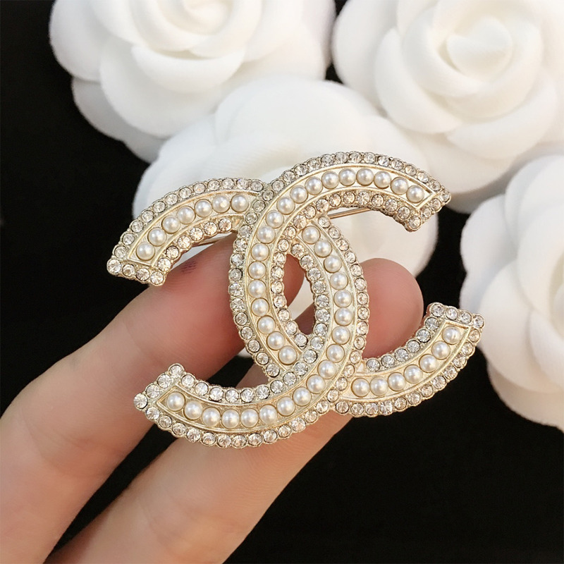 Ch*el brooch
