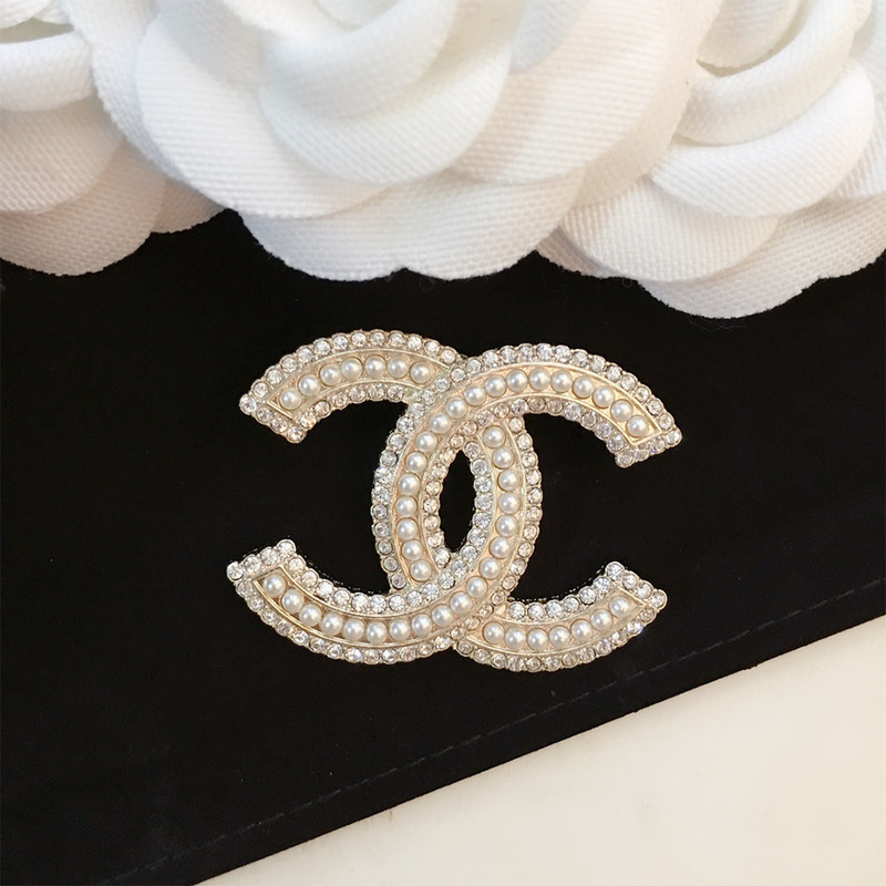 Ch*el brooch