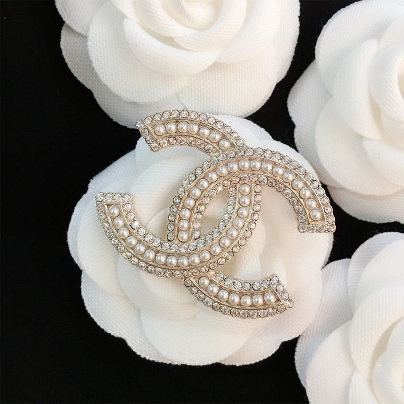 Ch*el brooch